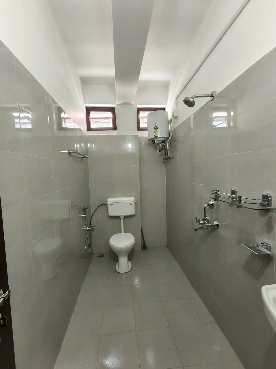 Attached bathroom with hot water geyser